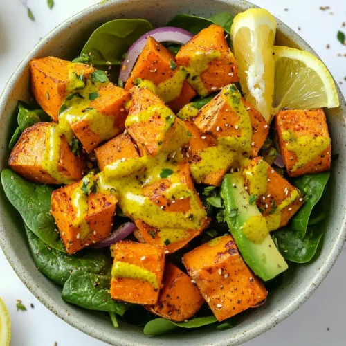 Pouring turmeric dressing over this vibrant Anti-Inflammatory Sweet Potato Salad Recipe.