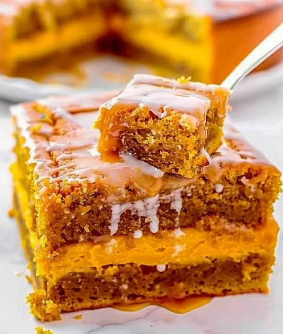 Delicious slice of Pumpkin Honey Bun Cake topped with icing on a rustic wooden table